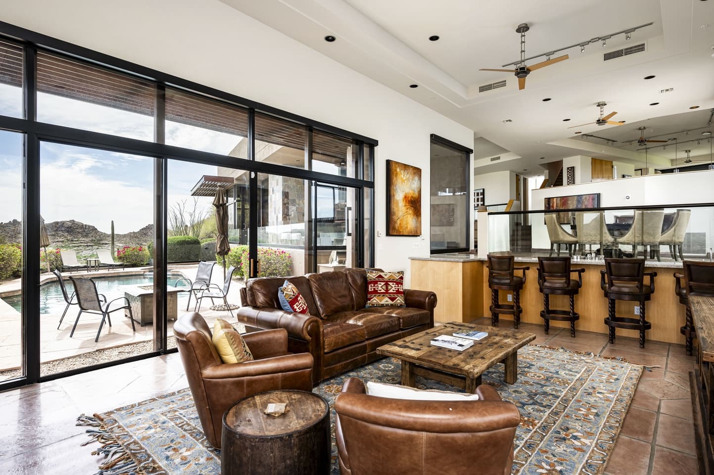 The Lower Great Room opening onto the pool patio at Saguaro Point
