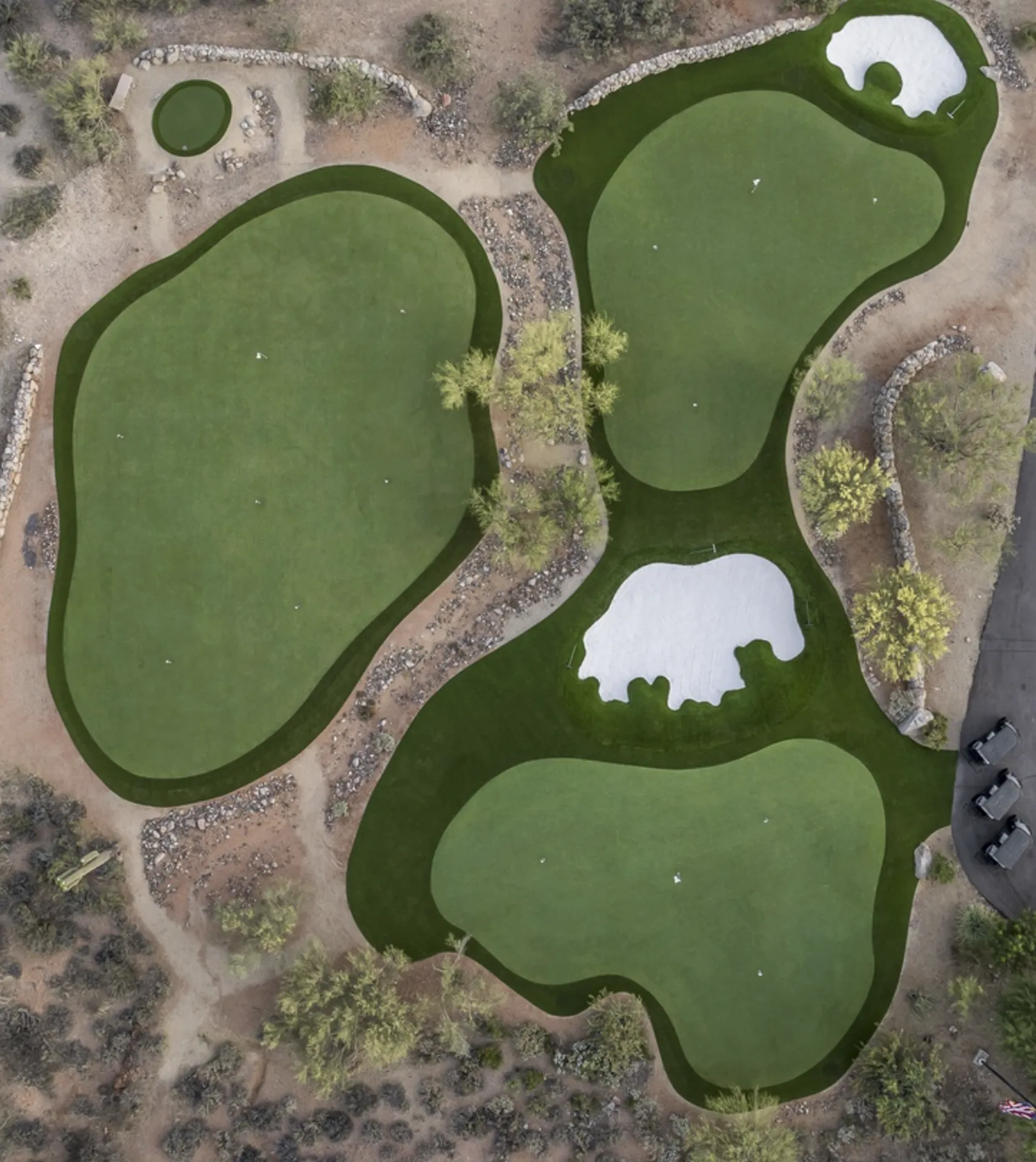 Top-down aerial of the four private greens, bunkers, and cart path at Saguaro Point
