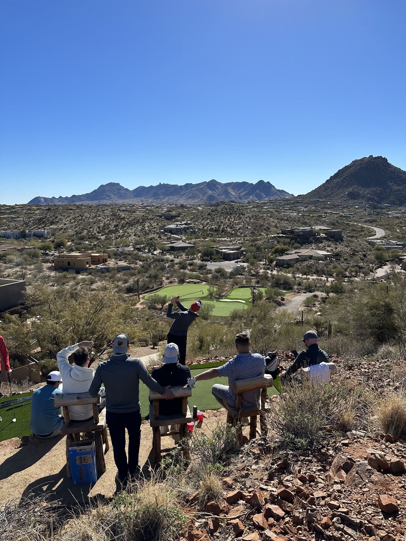 A group gathered on the private practice greens at Saguaro Point