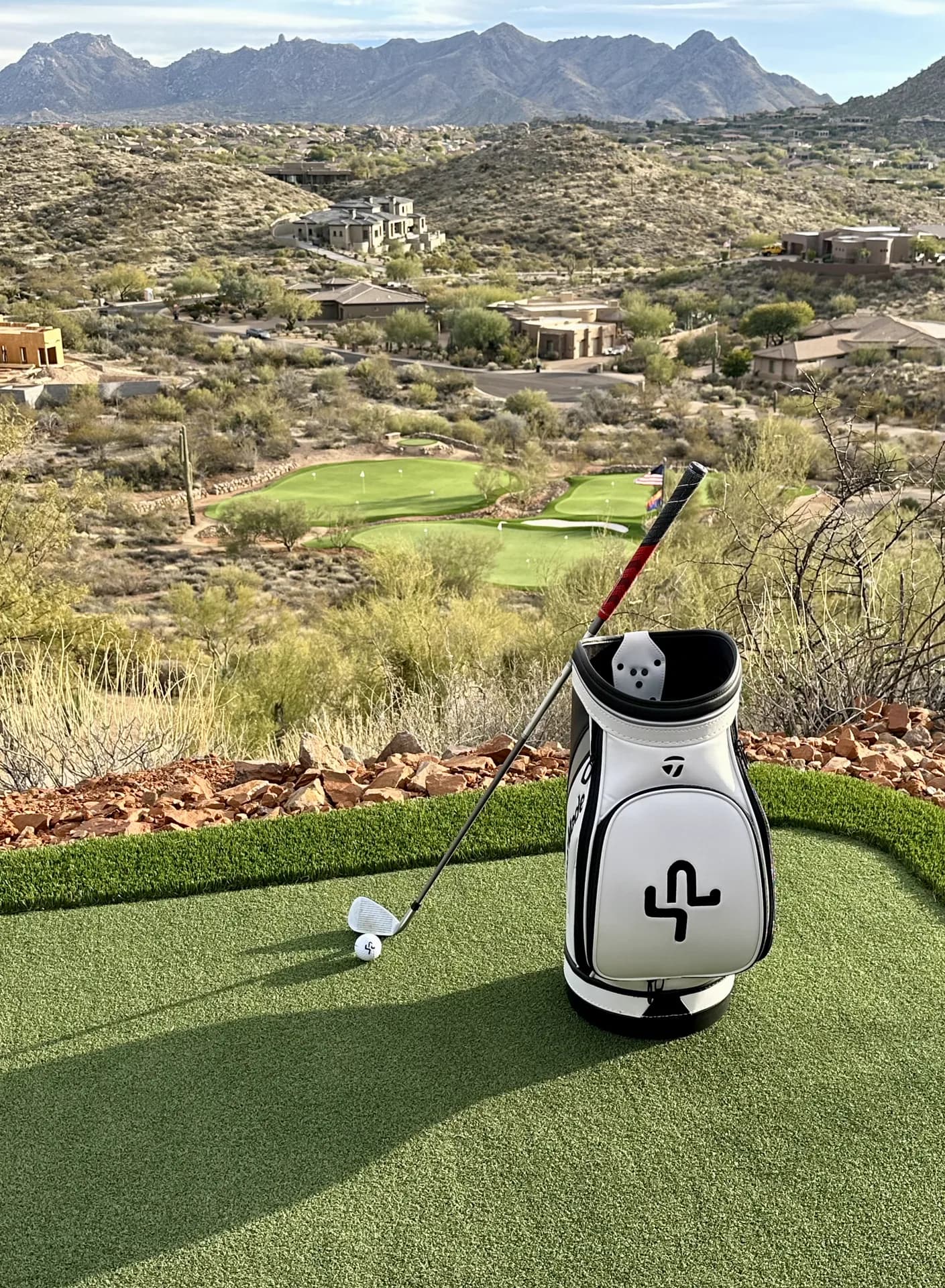 A staged bag on the elevated tee overlooking the greens