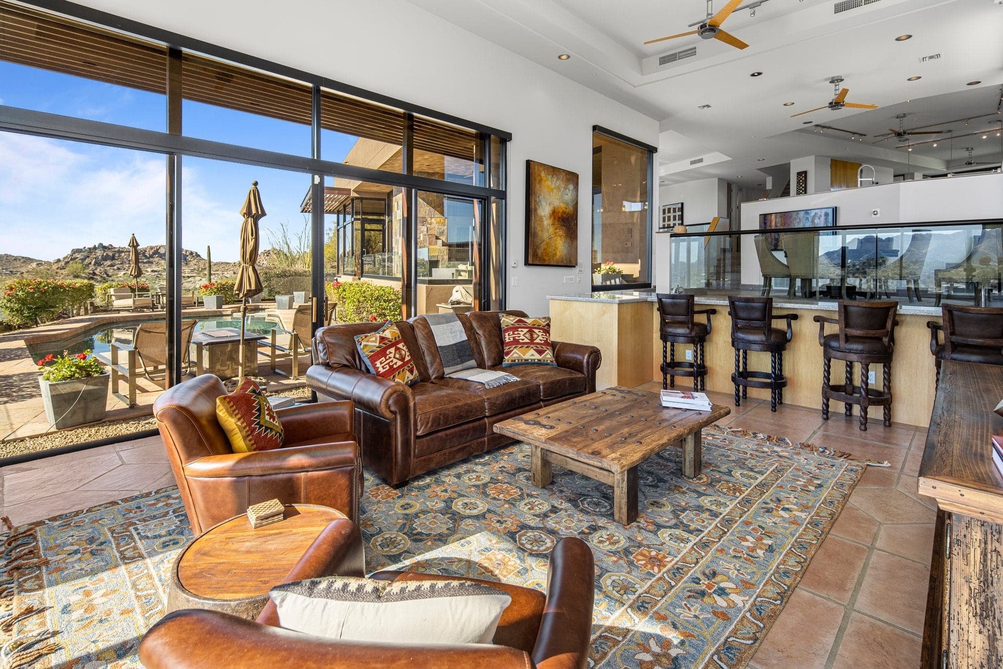 The Upper Great Room with golf memorabilia and a large TV, set up as a session and breakout space