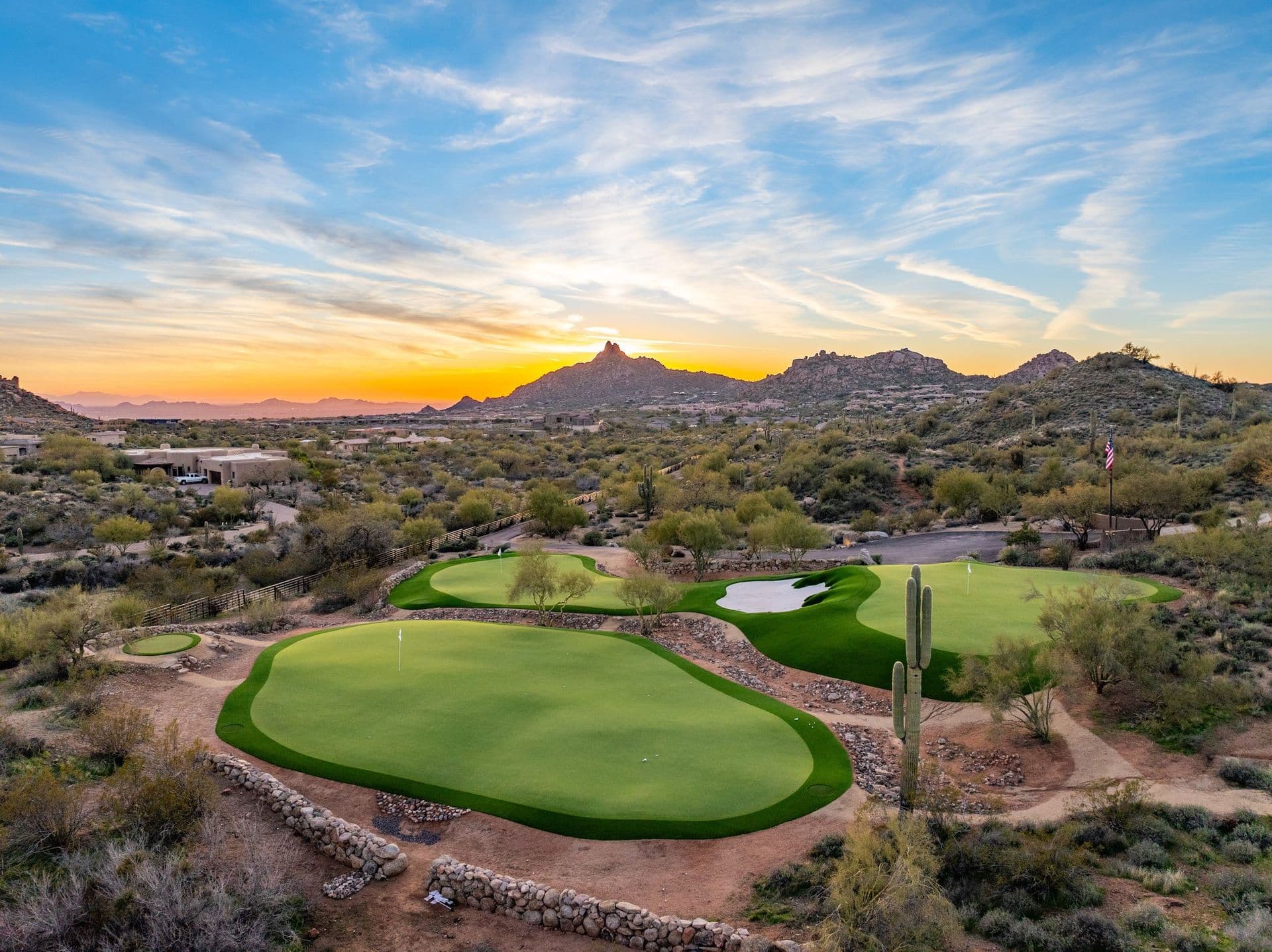 Saguaro Point private golf complex at sunset with Pinnacle Peak on the horizon